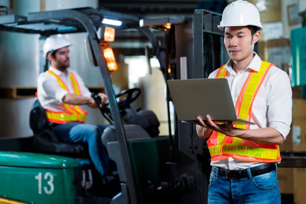 engineer staff male warehouse worker hard hat working walking through logistics center warehouse factory construction site logistics architect forklife driver man builder indoors background